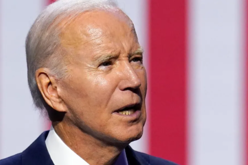 Onlookers Erupt When They See What's At Biden's Feet During Recent Speech