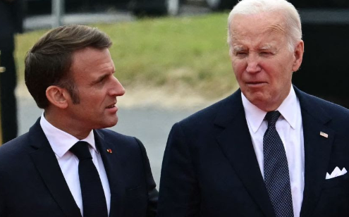 Hot Mic Catches Biden’s Strange Comment to French President at D-Day Event